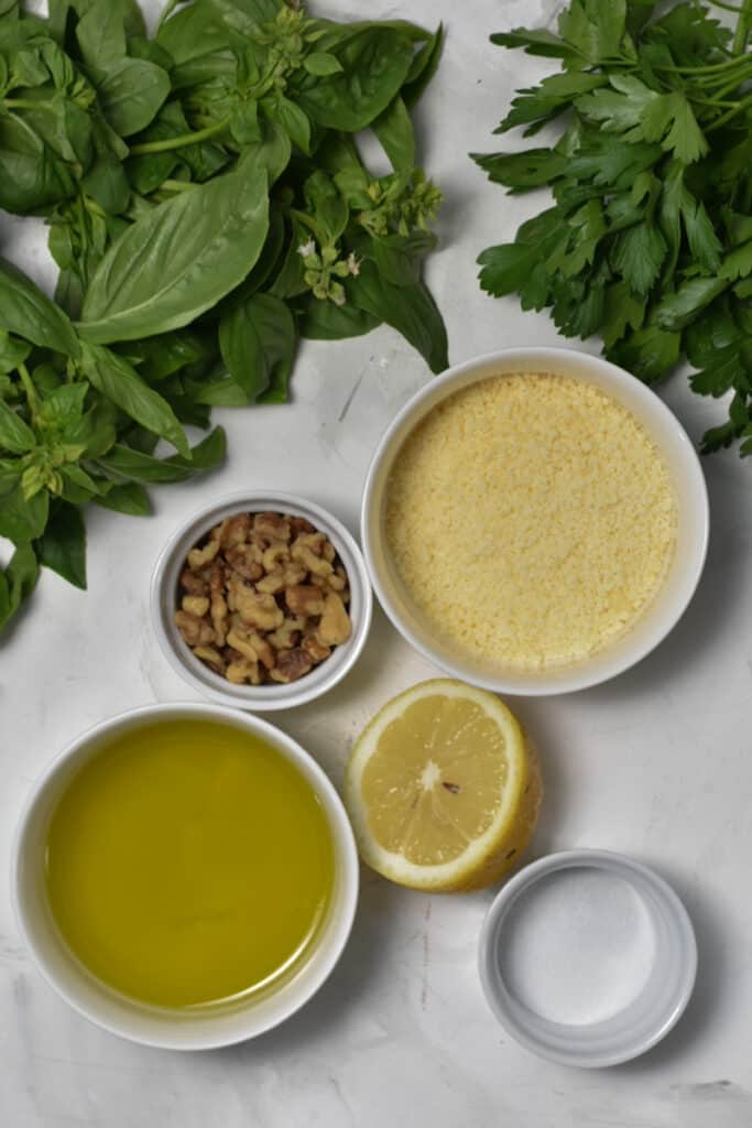 Walnut Pesto ingredients laid out in bowls