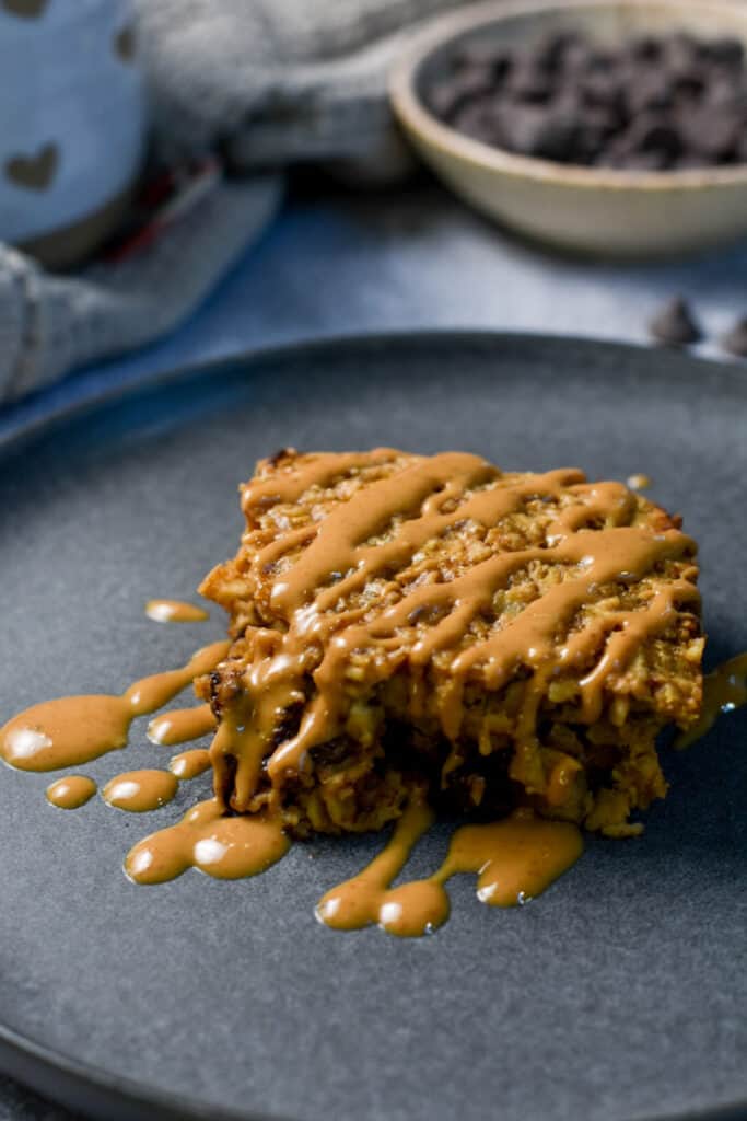 Chocolate peanut butter baked oatmeal drizzled with melted peanut butter