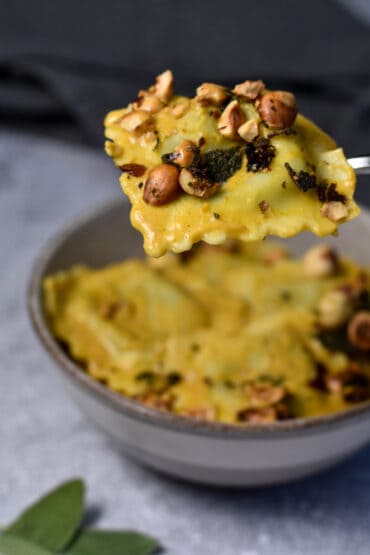 Pumpkin Pasta with Toasted hazelnuts and sage on a spoon