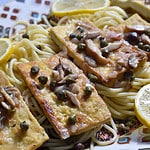 Tofu Piccata on a platter of spaghetti