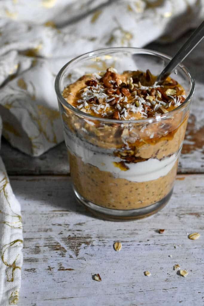 Pumpkin Pie Overnight Oats with a decorative towel