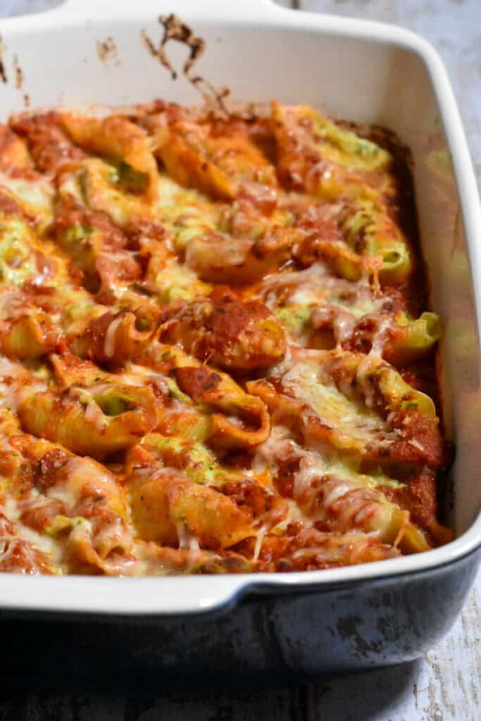 Healthy stuffed shells in a blue casserole dish