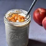 Peach Pie Overnight oats in a mason jar with peaches in the