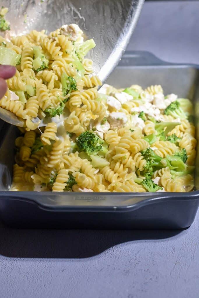pouring in past chicken broccoli bake into a 13x9 pan