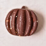 frozen chocolate peanut butter banana bites in a pumpkin shape